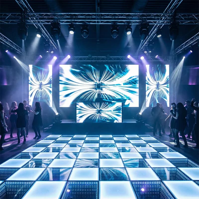Alternating white frosted and mirrored floor tiles illuminated in a stage setting