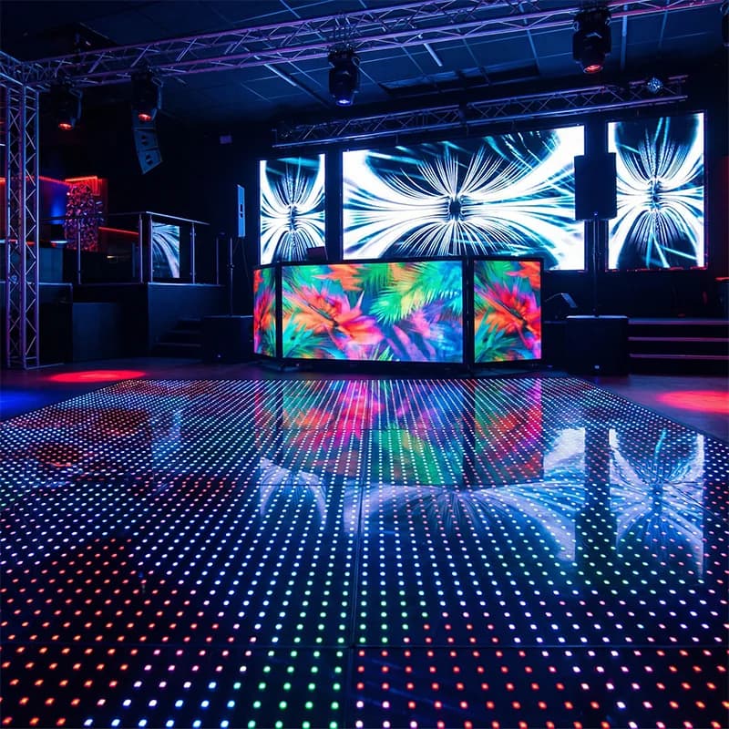 Dense RGB pixel lighting across a modular LED dance floor
