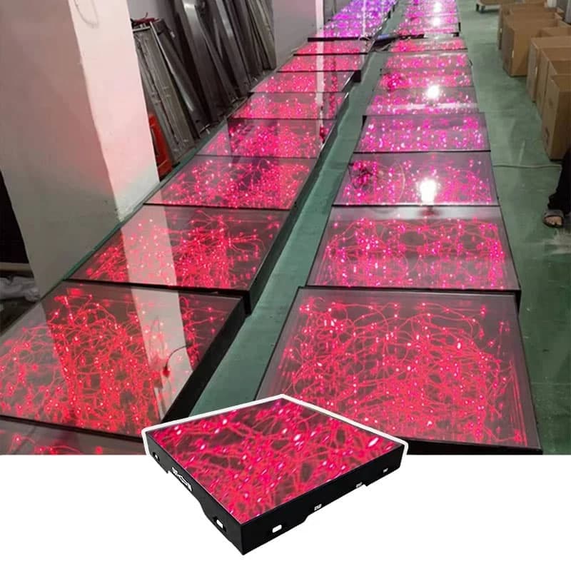 Rows of mirrored star LED dance floor panels glowing red with a panel inset